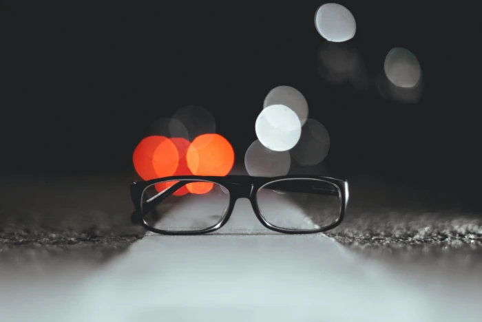 bokeh light photography of eyeglasses on pavement shallow focus 2k 4k 5k