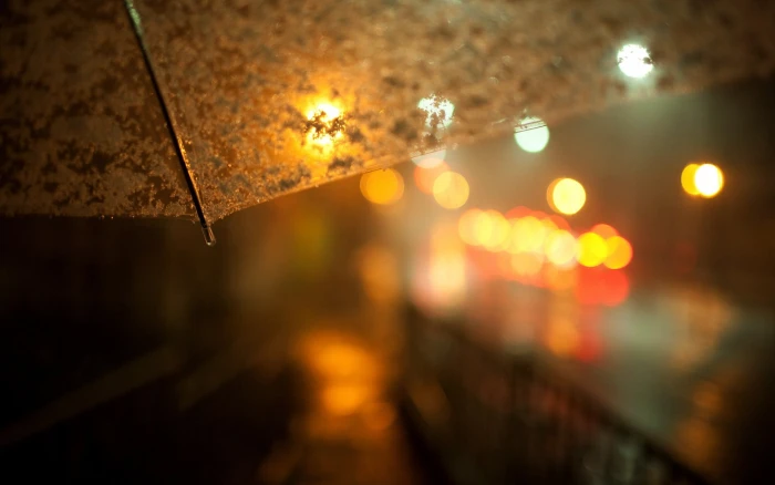 brown umbrella bokeh photography of gray rain night 2k