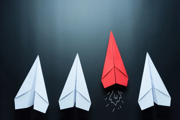 three white and one red paperplanes surface wall minimalism 2k 4k 5k