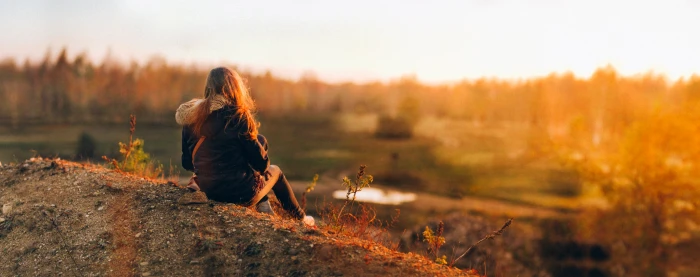 woman in parka jacket sitting during sunset Panoramic Pentacon 2k 4k 5k