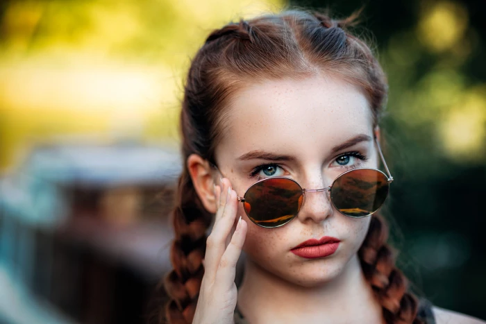 women redhead with shades face braids outdoors 2k