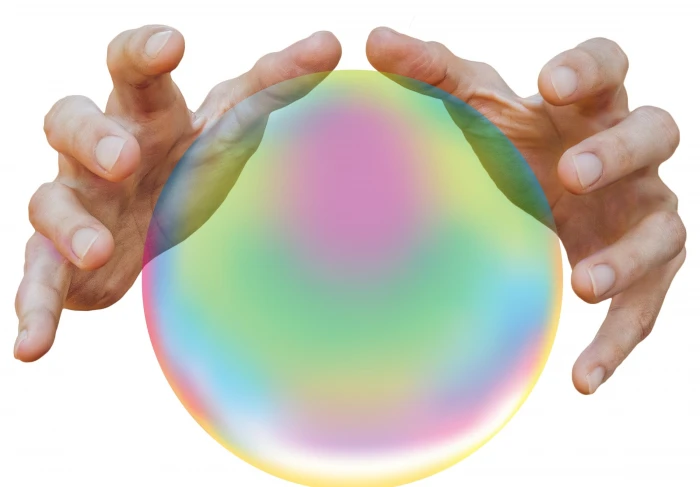 person s hands near iridescent ball fortune telling future 2k
