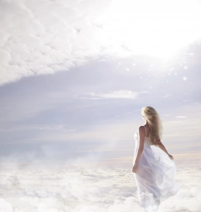 photo of woman in white spaghetti strap dress on clouds sky 2k 4k