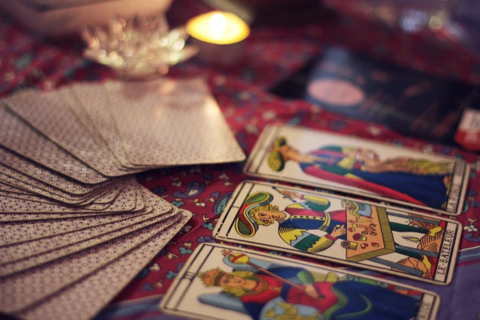 tarot cards on red floral textile fortune symbol mystery paranormal 2k 4k 5k