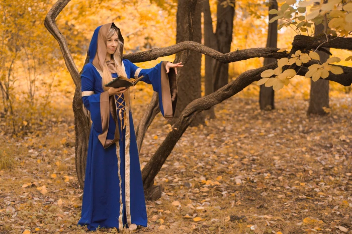 woman dressed as a wizard in the forest casting spell magic 2k 4k 5k