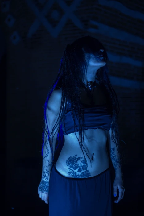 woman wearing crop top and skirt looking up girl a vampire 2k