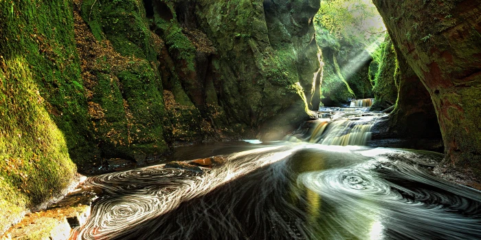 body of water going in mossy cave Gorge Sunbeams Scotland 2k 4k