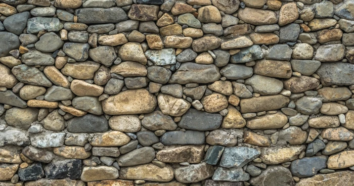 photo of brown and black stone wall damme texture pattern 2k 4k 5k