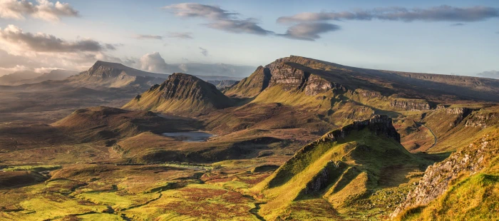 landscape photo of rocky mountains under cloudy sky quiraing skye scotland 2k 4k 5k