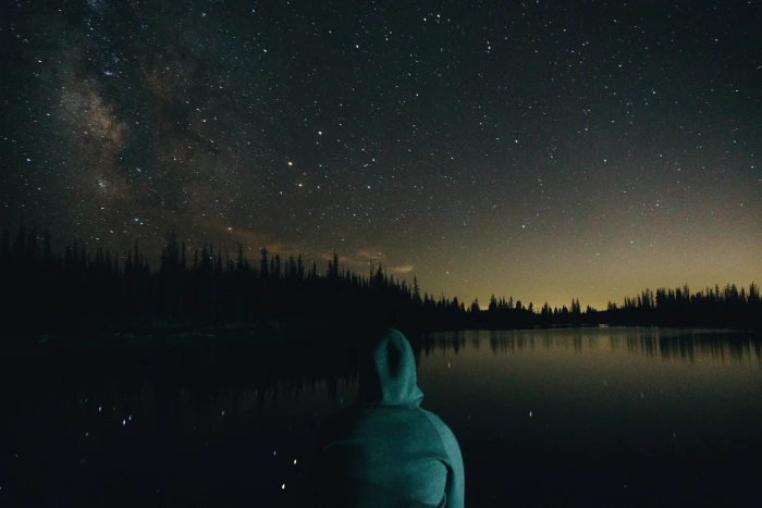 person wearing hoodie looking at nebula teal night time dark 2k 4k 5k