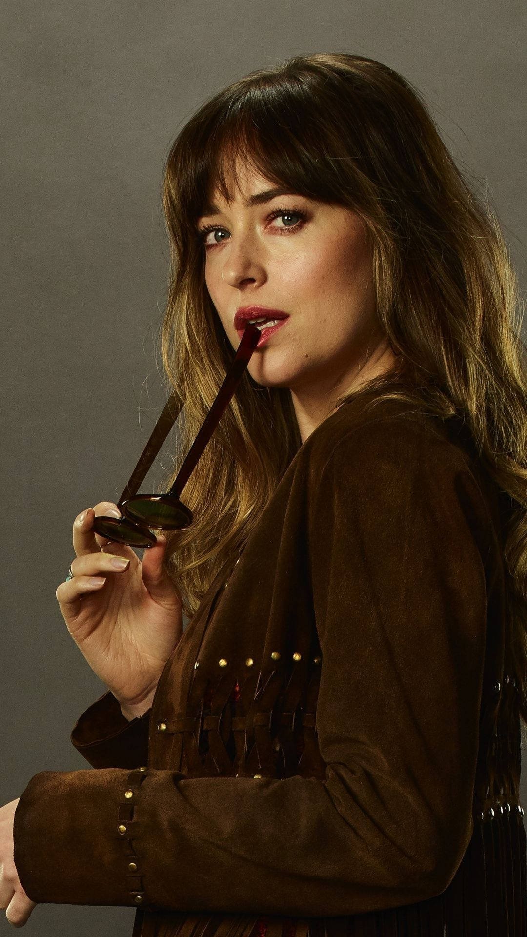 dakota johnson biting sunglasses actress hollywood