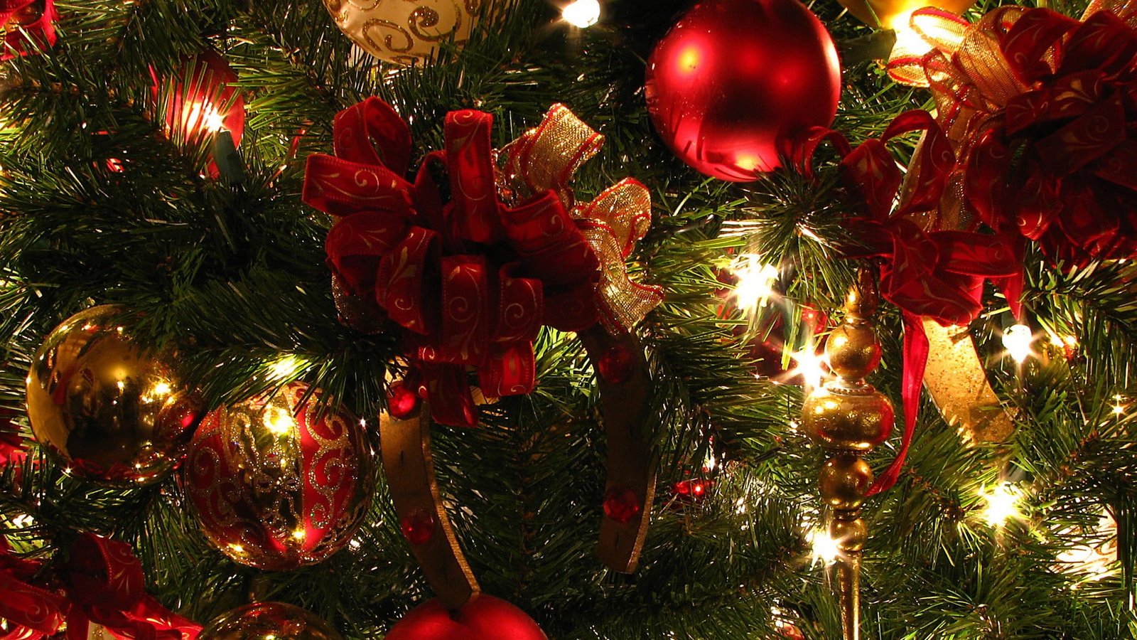 red green and brown Christmas tree with string lights baubles