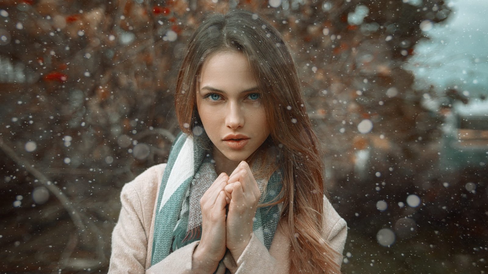 women's pink top woman wearing brown coat with green scarf during winter