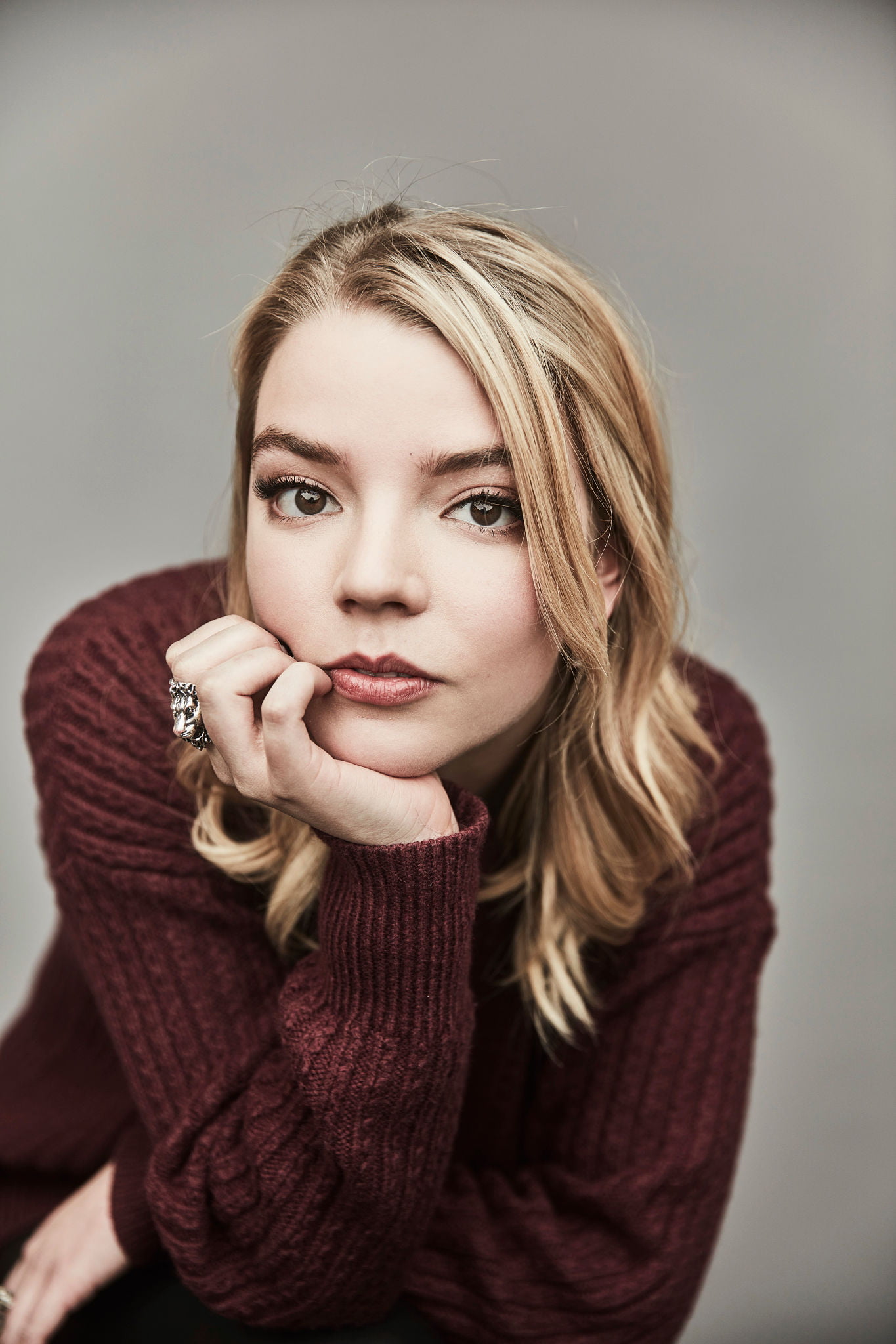 Anya Taylor Joy women actress blonde sweater simple background