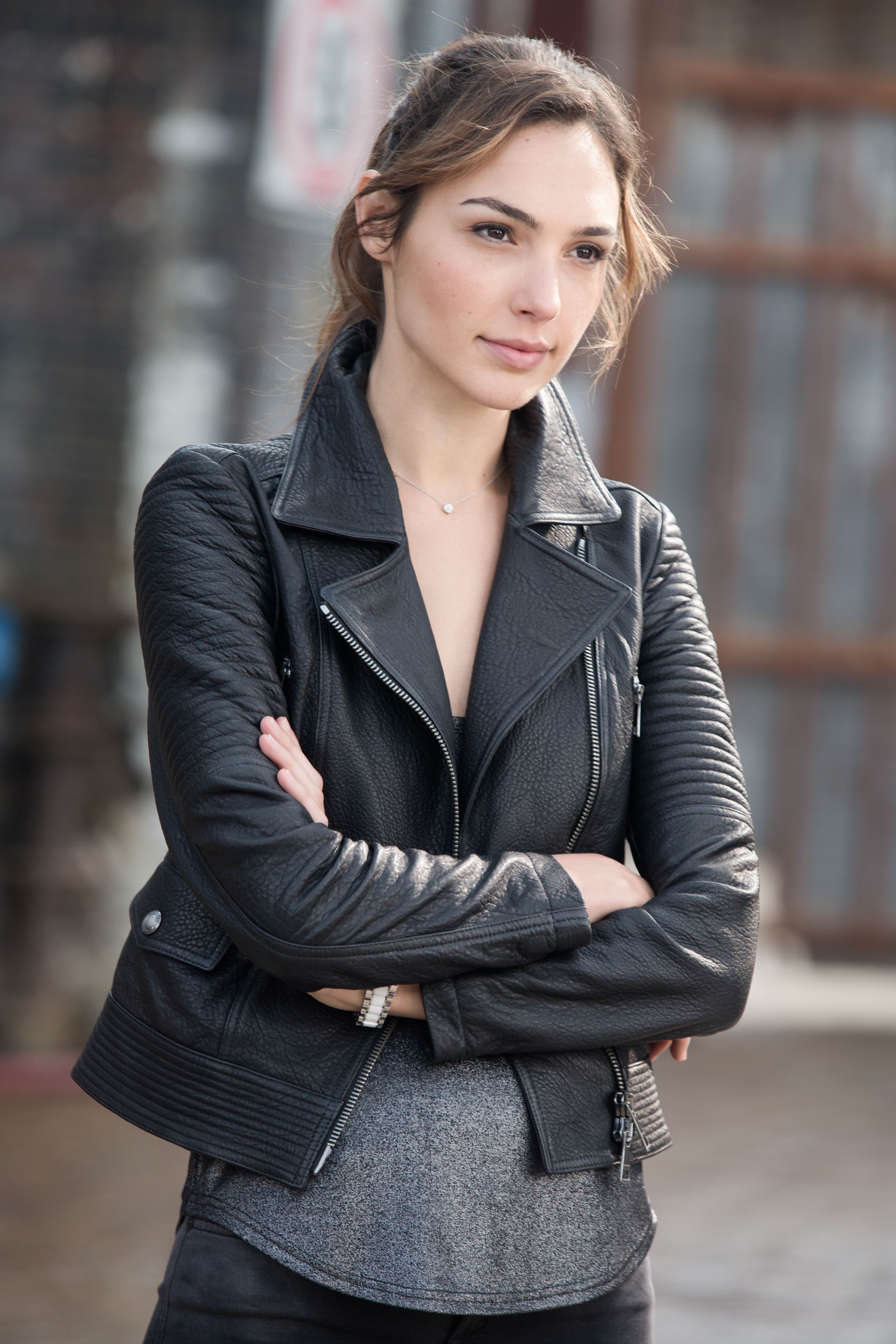 Gal Gadot actress leather jackets brunette looking away into the distance 2k