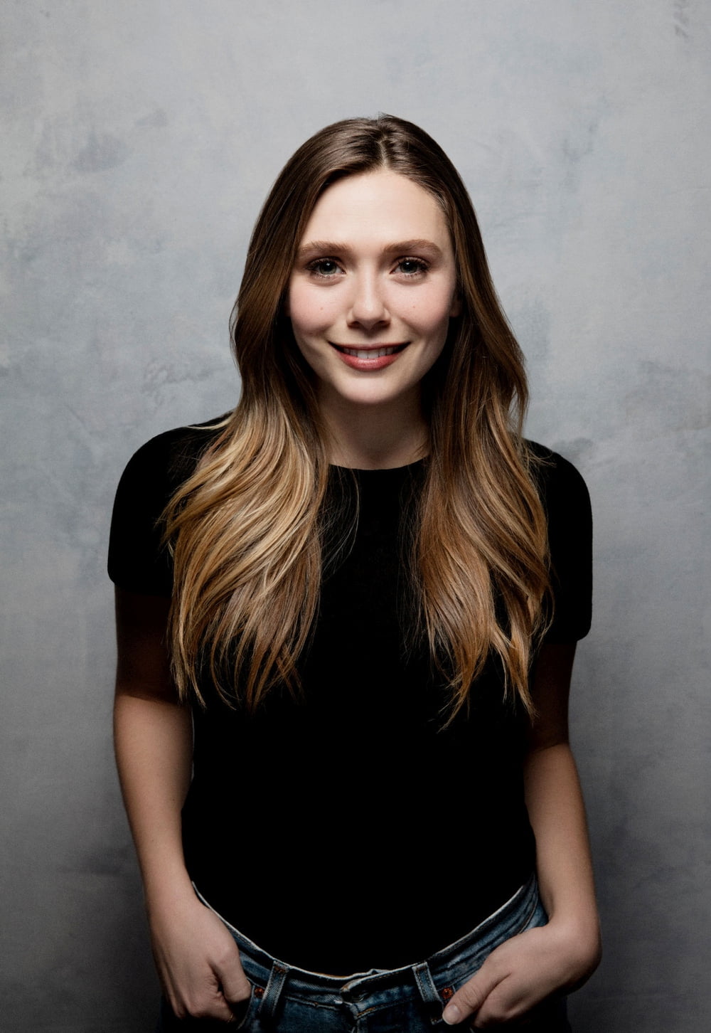 Elizabeth Olsen women actress long hair smiling hands in pockets