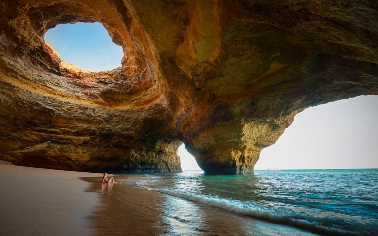 body of water nature landscape sea cave beach sand women outdoors