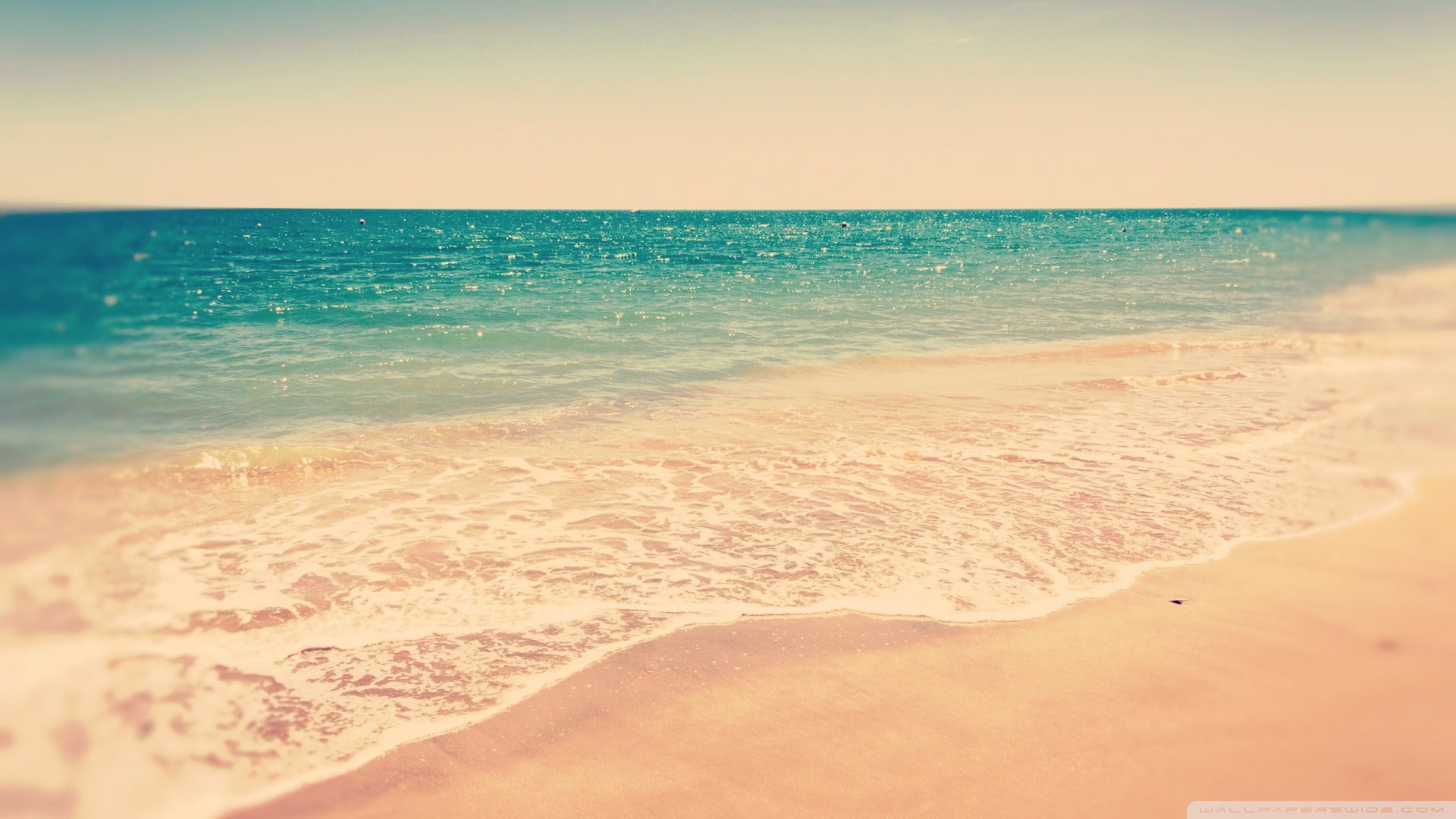 beach sea sand waves horizon land water sky over 2k