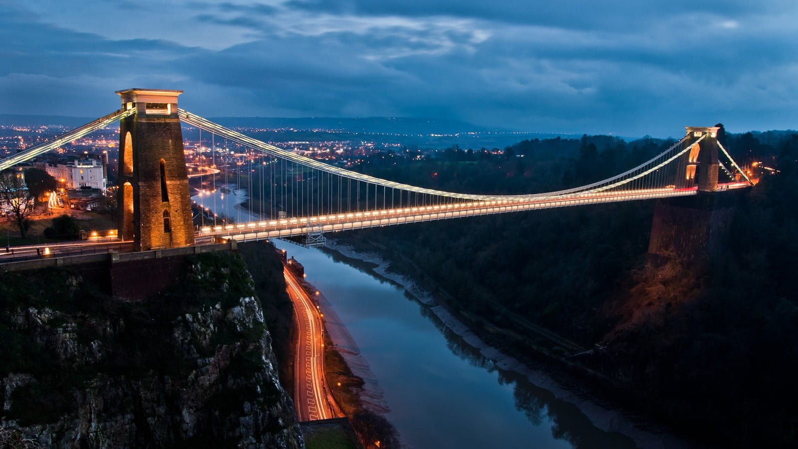 brown and gray bridge black concrete suspension at night 2k