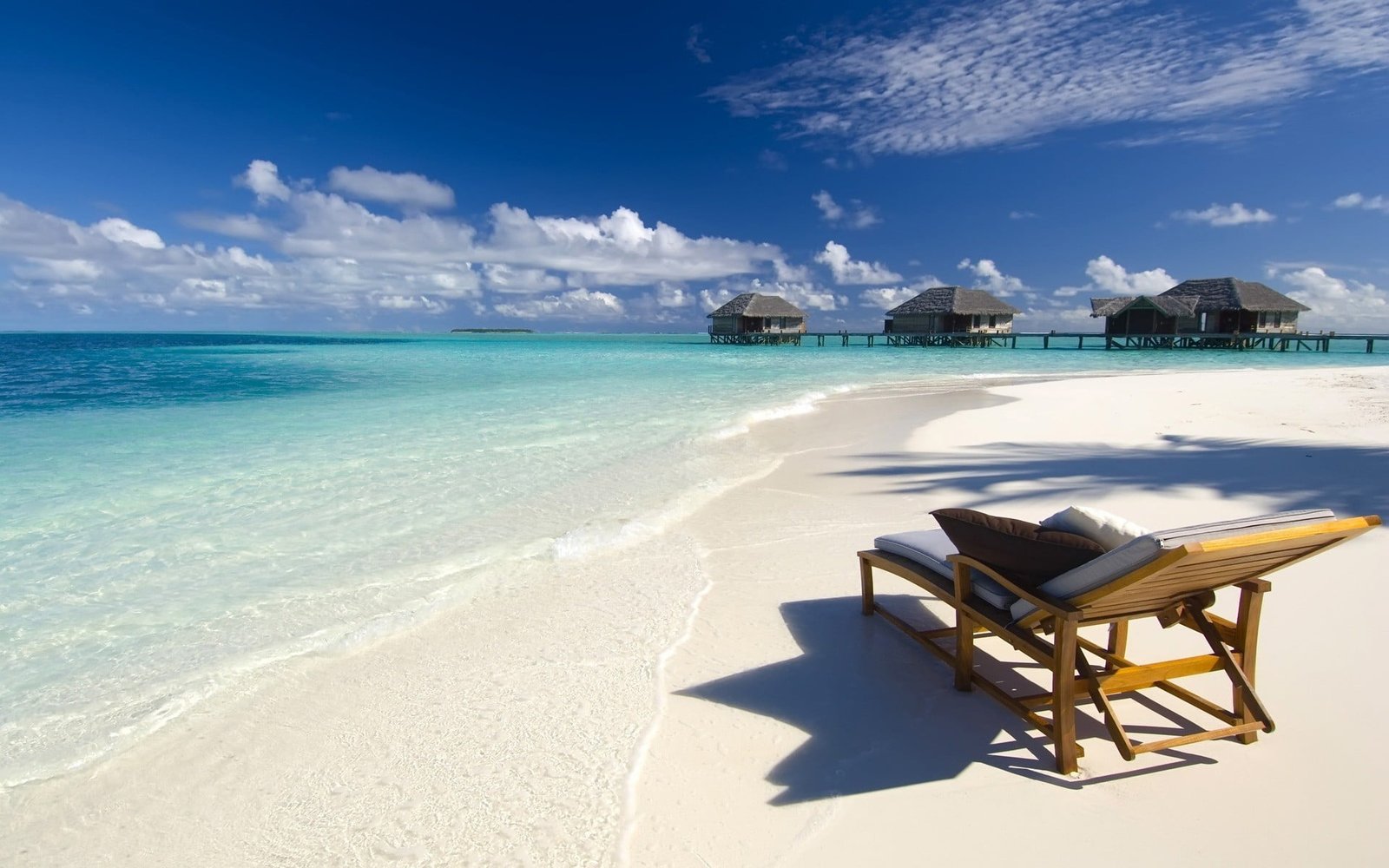 brown wooden lounge chair Maldives beach sea nature water 2k