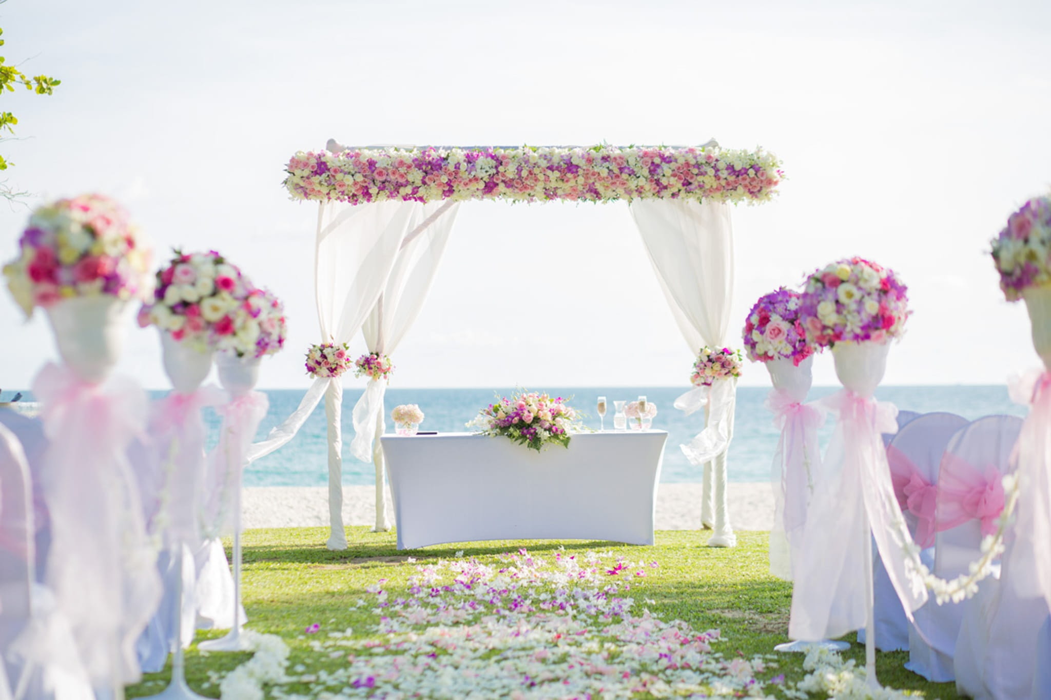 white pink and yellow floral wedding arch during daytime Flower 2k