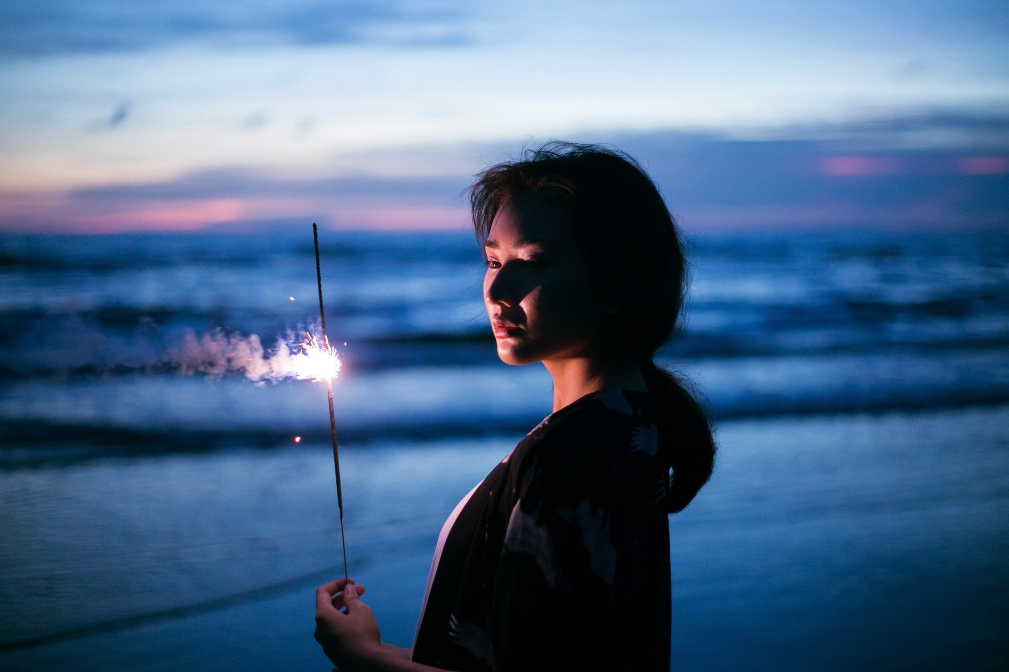 women outdoors Asian beach fireworks 2k