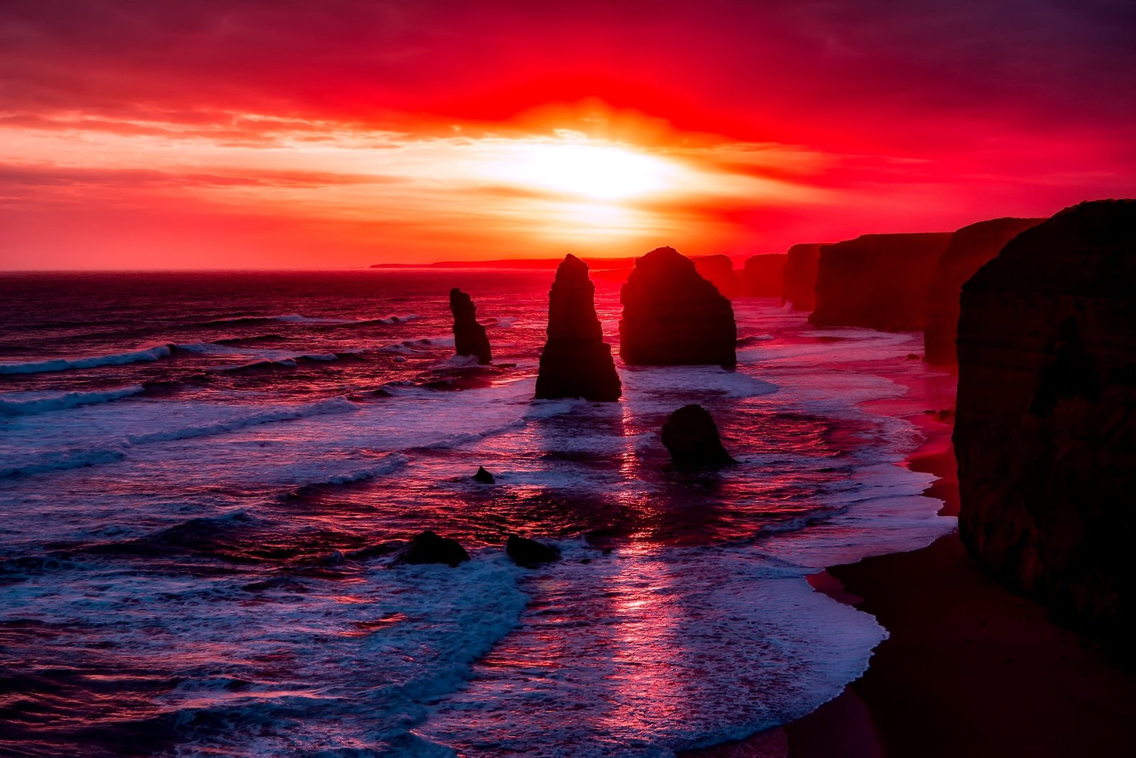 silhouette of rock formation during golden hour monoliths body water 2k