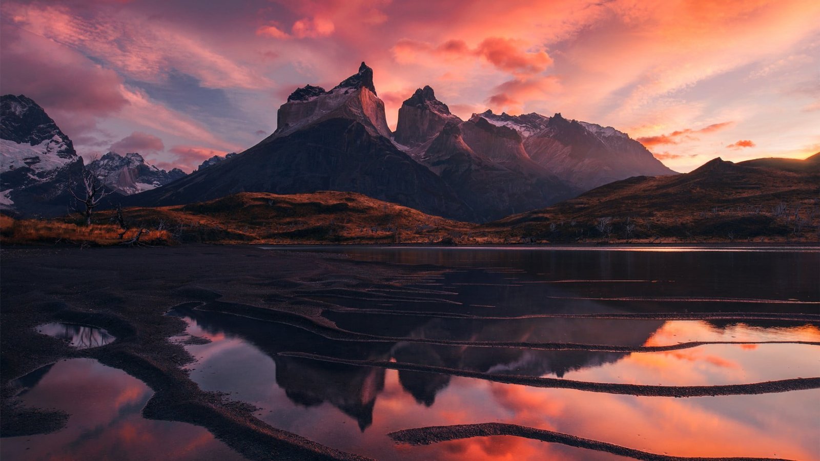 large body of water near mountain during sunset landscape mountains 2k