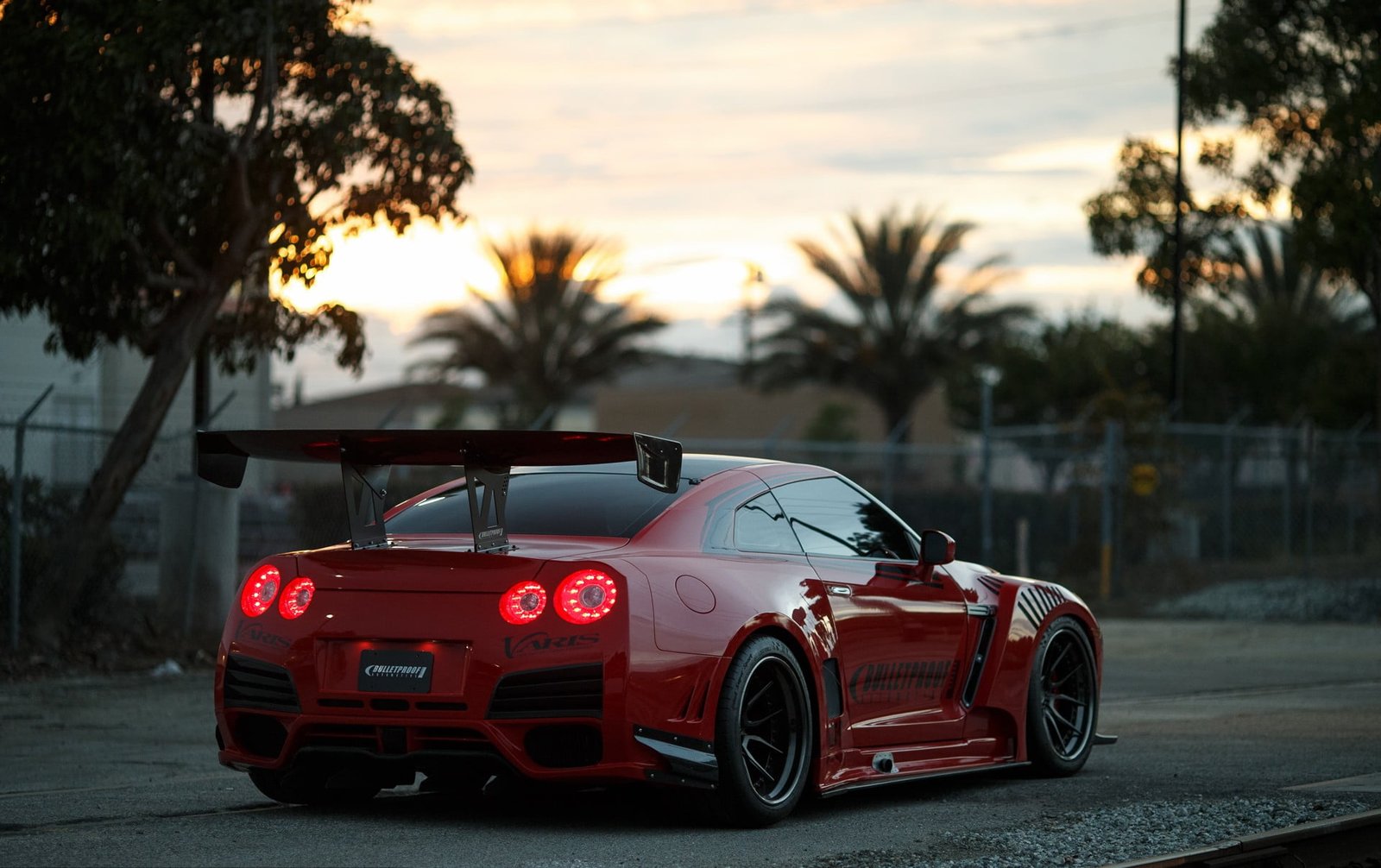 red sports car Nissan race cars road GT R 2k