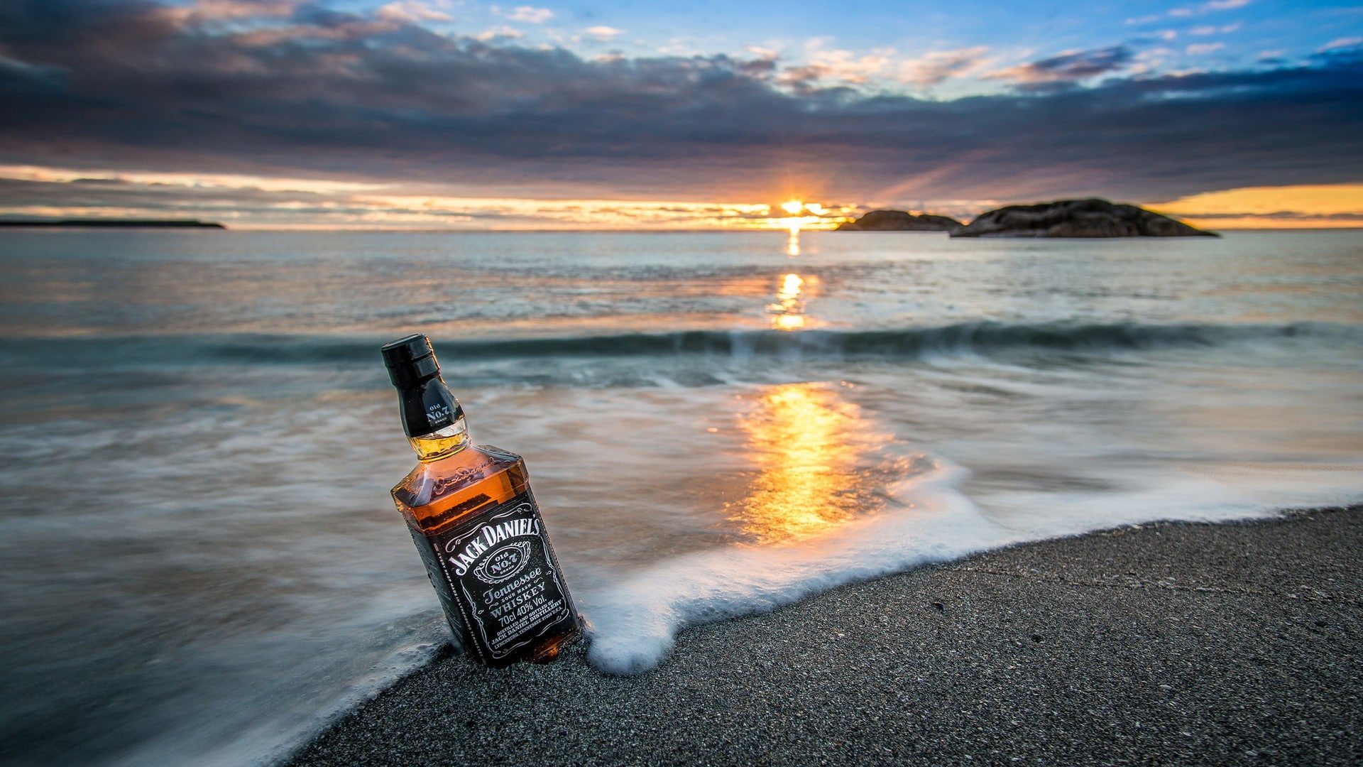 horizon waves rock nature landscape sunrise sand bottles reflection sea clouds island coast beach whiskey Jack Daniels 2k