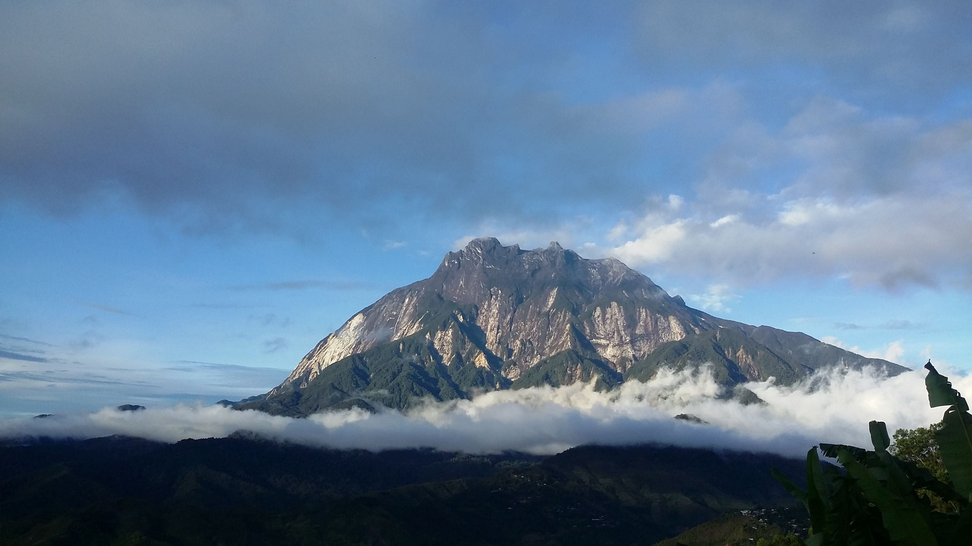 mountain surrounded by clouds Mount Kinabalu Sabah World heritage 2k