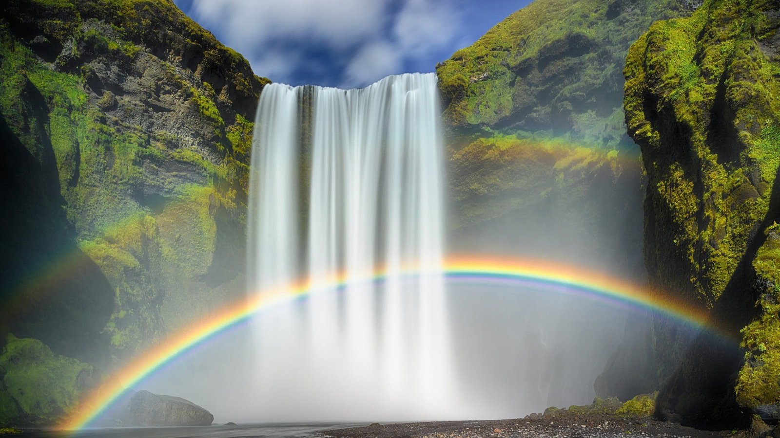 Skogafoss waterfalls between green trees nature 2k