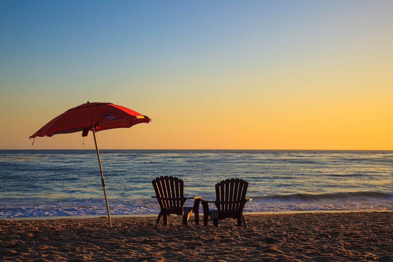 two brown armchairs beach sunset sea sand relaxation minimalism 2k