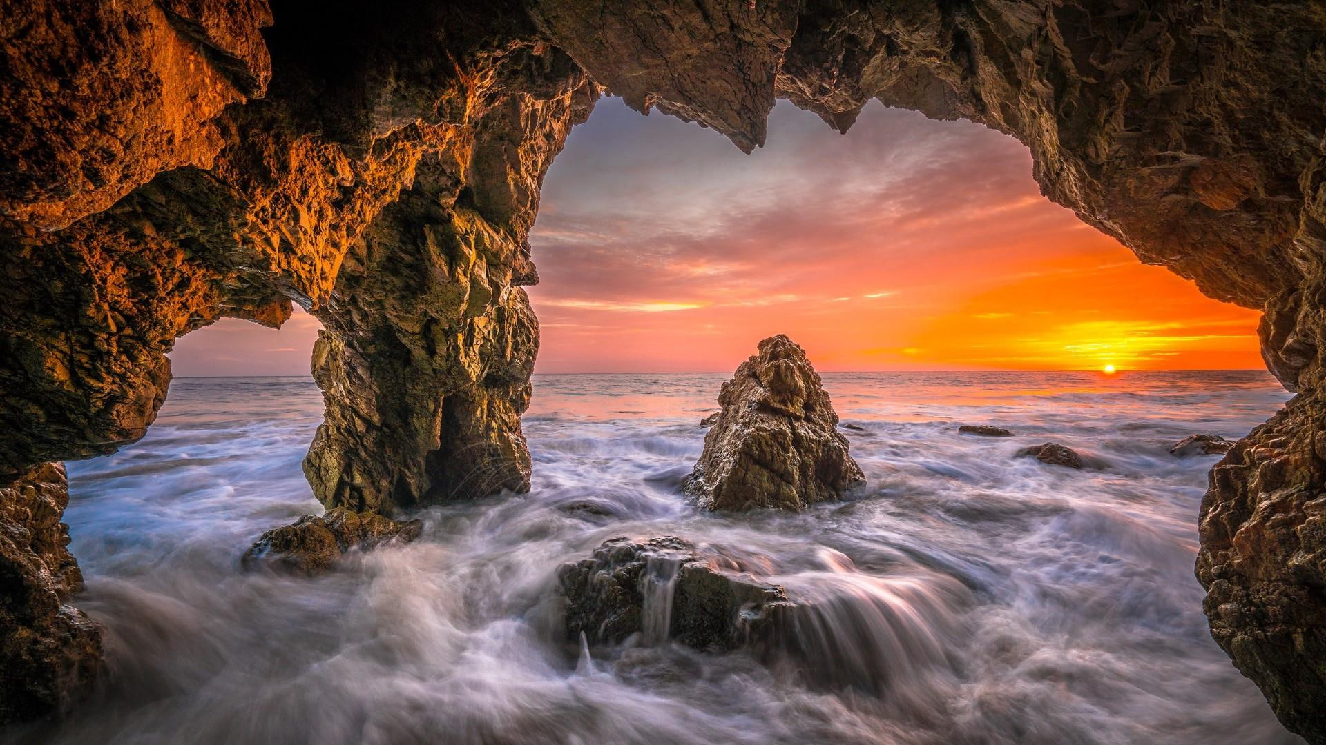 shore natural arch cave orange sky dawn california usa 2k