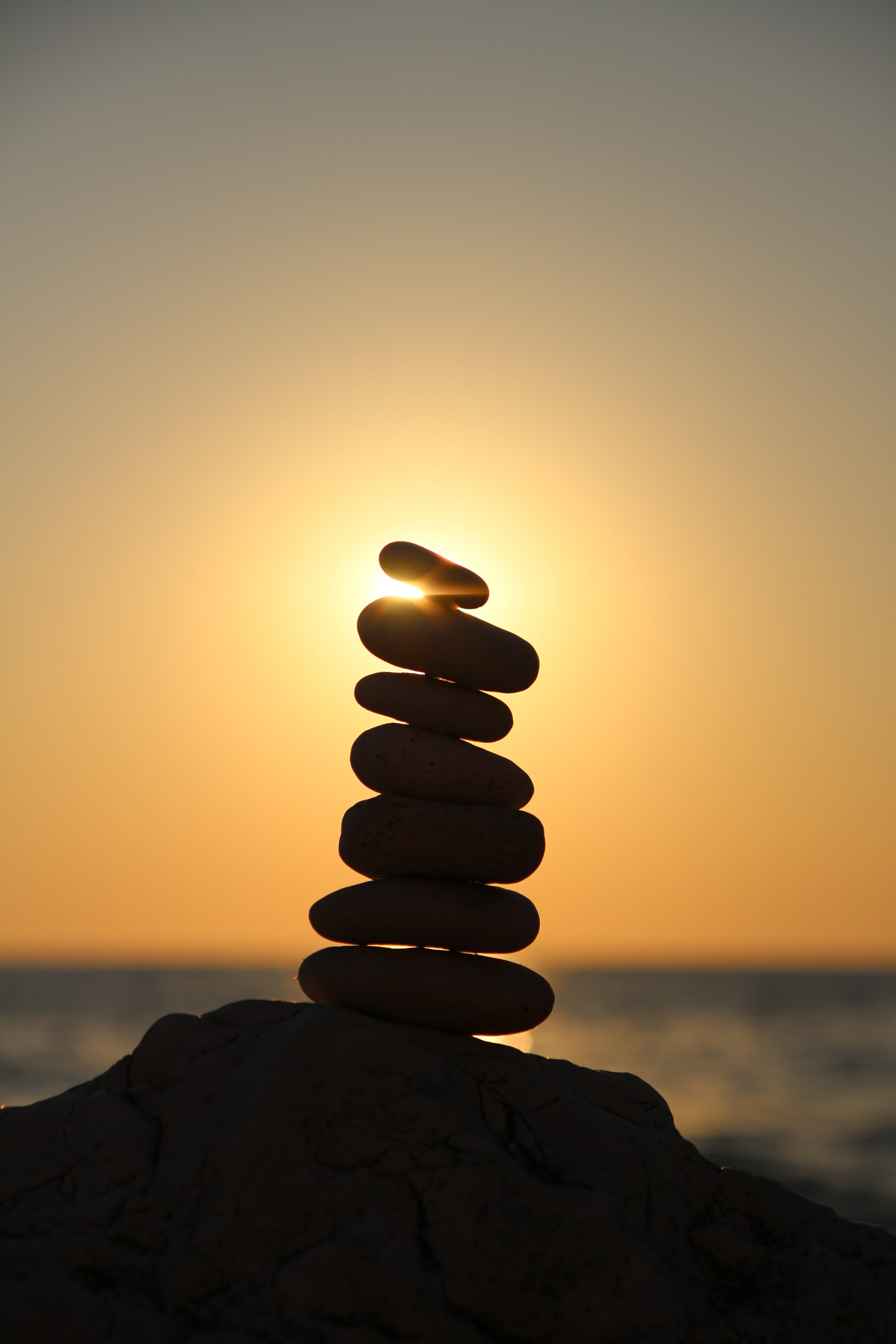 silhouette photography of stone balancing balance stones tower 2k