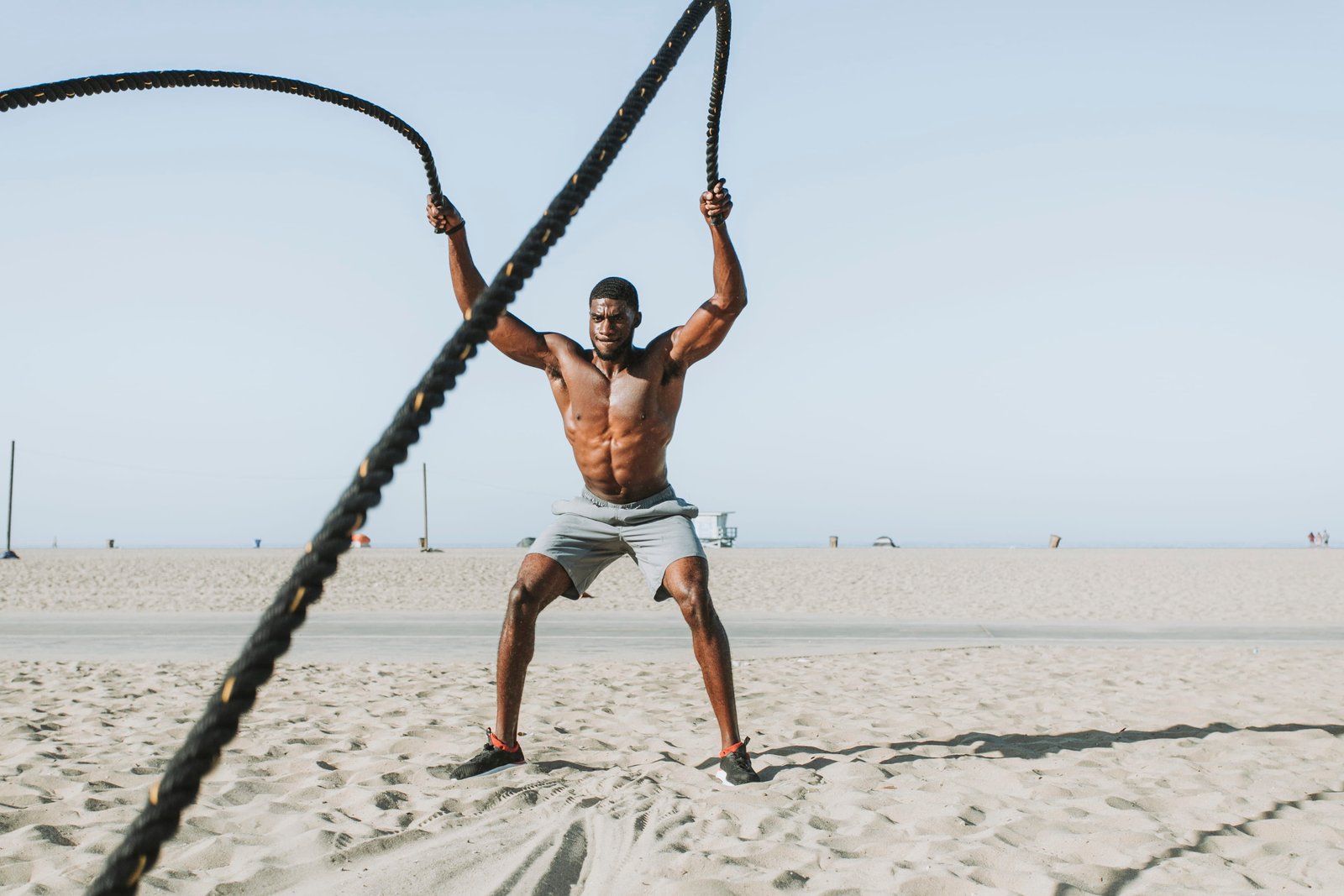 Man Holding Rope on Both Hands athlete beach biceps body 2k 4k