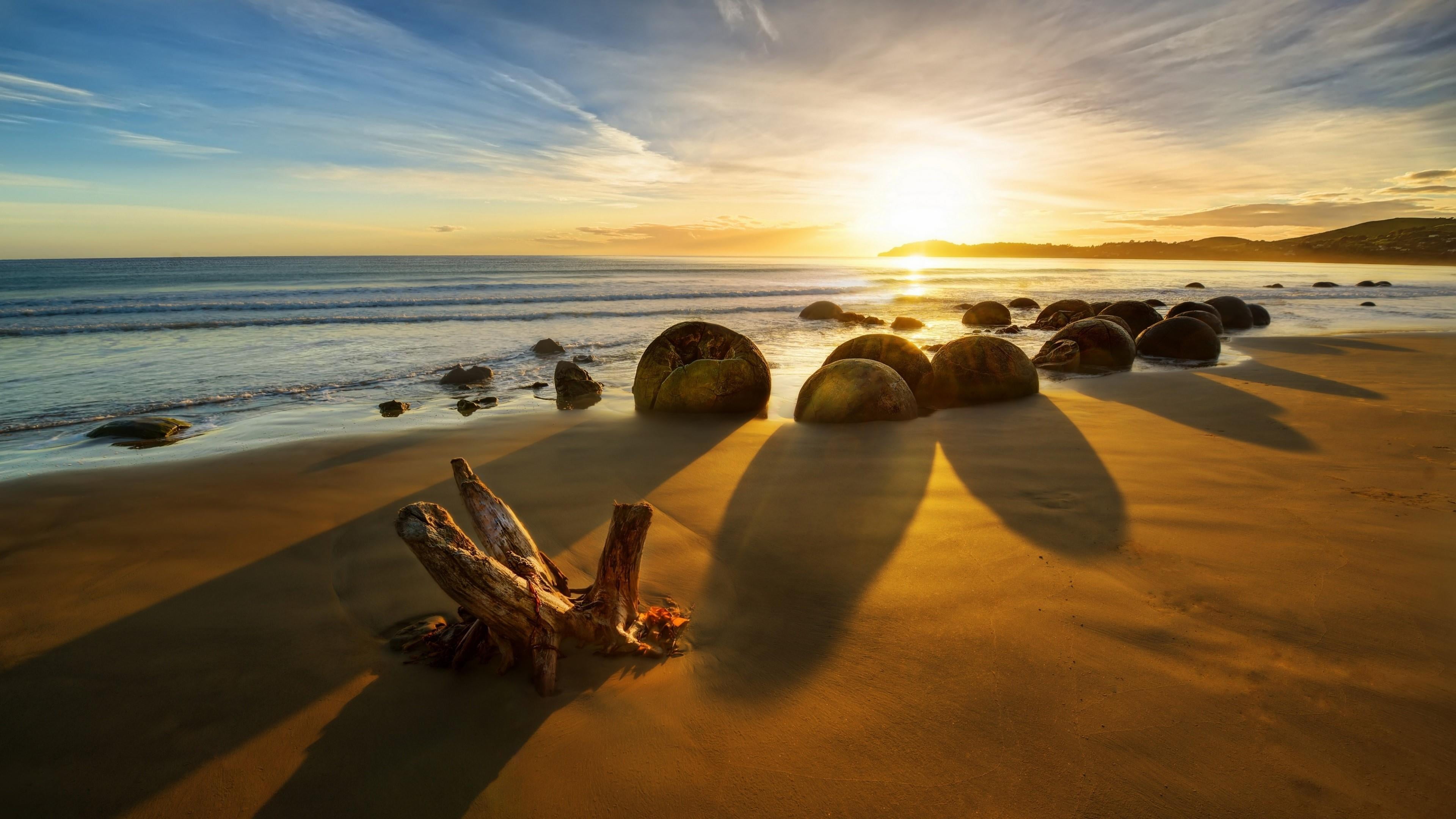 sunrise koekohe beach moeraki boulders new zealand sunlight 2k 4k