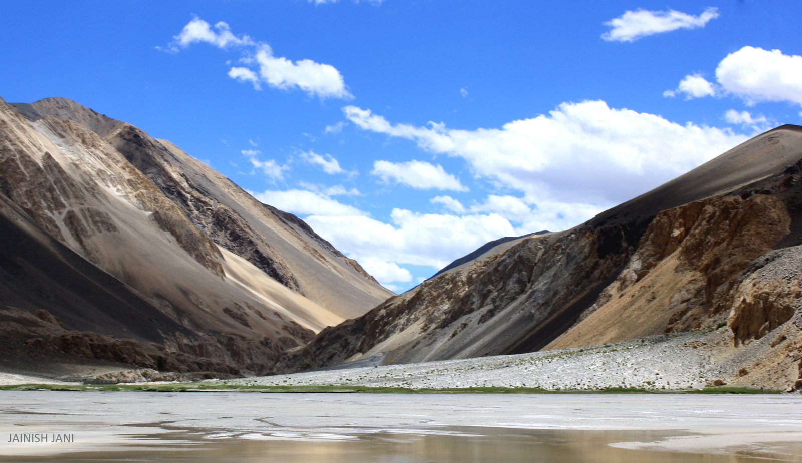 photography of white and brown mountain cloudy sky during daytime ladakh 2k