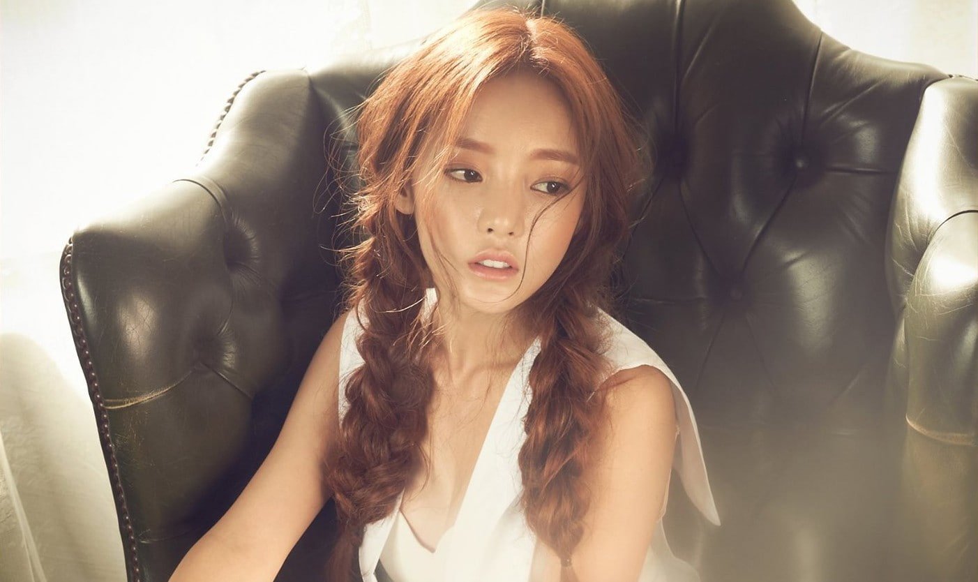 Kara Asian women chair K pop Hara Korean looking away