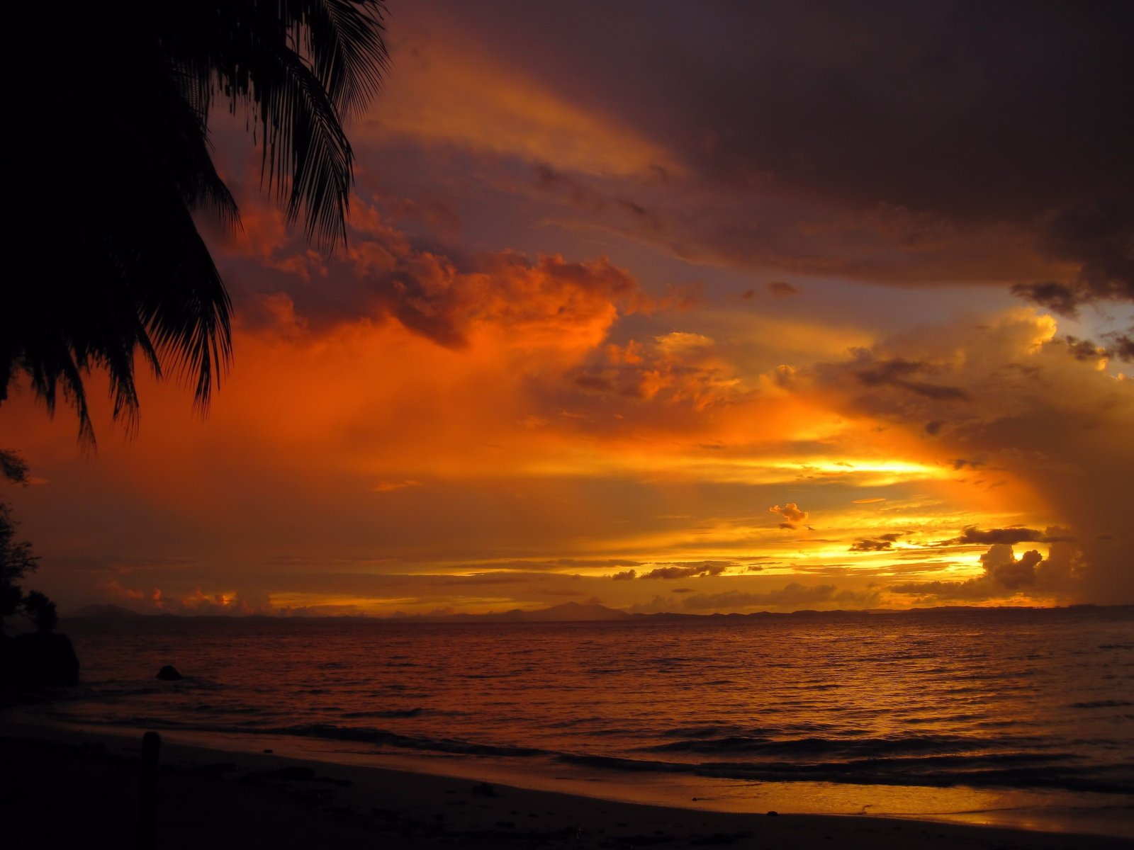 brown wooden framed painting of body water beach sunset 2k 4k