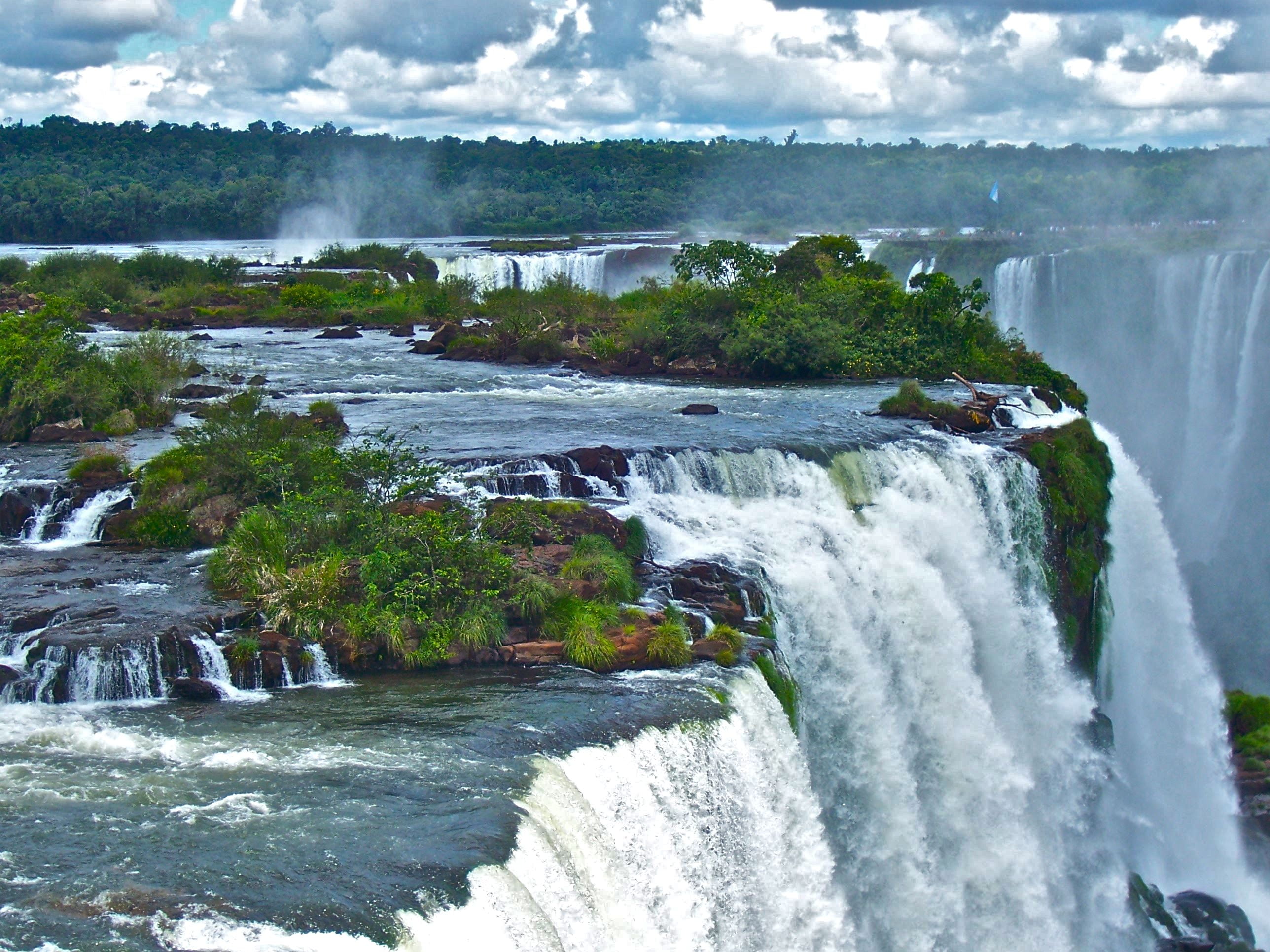 landscape aerial photography of waterfall with green trees during daytime 2k