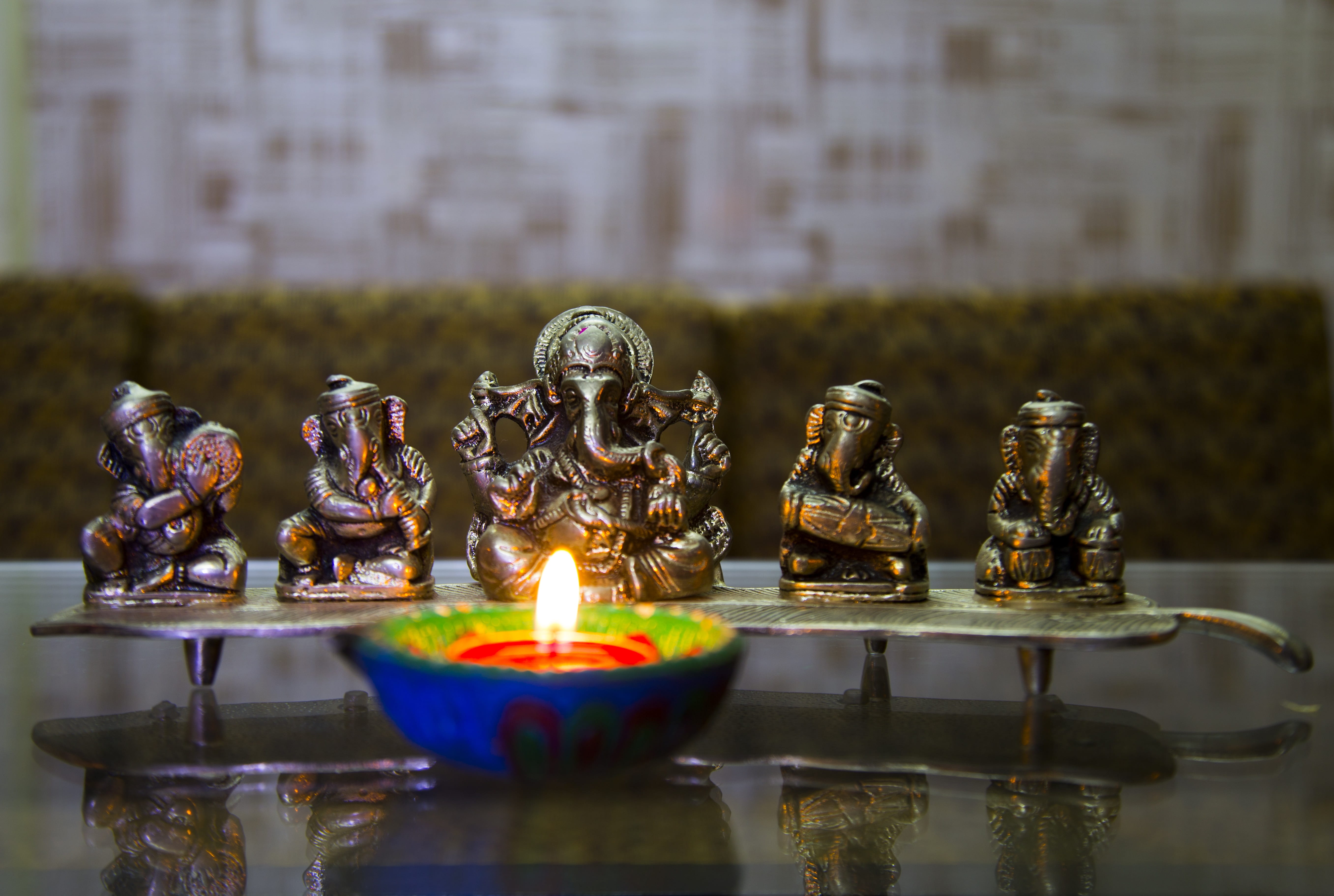 selective focus photography of Ganesha figurine puja deepavali 2k 4k 5k