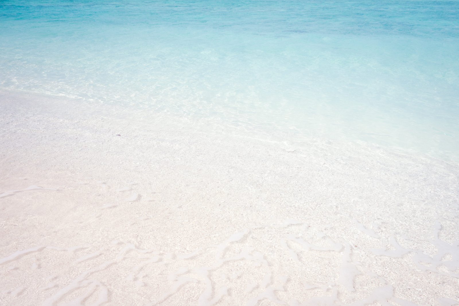 wave of water on sea shore white sand beach during daytime texture 2k 4k 5k