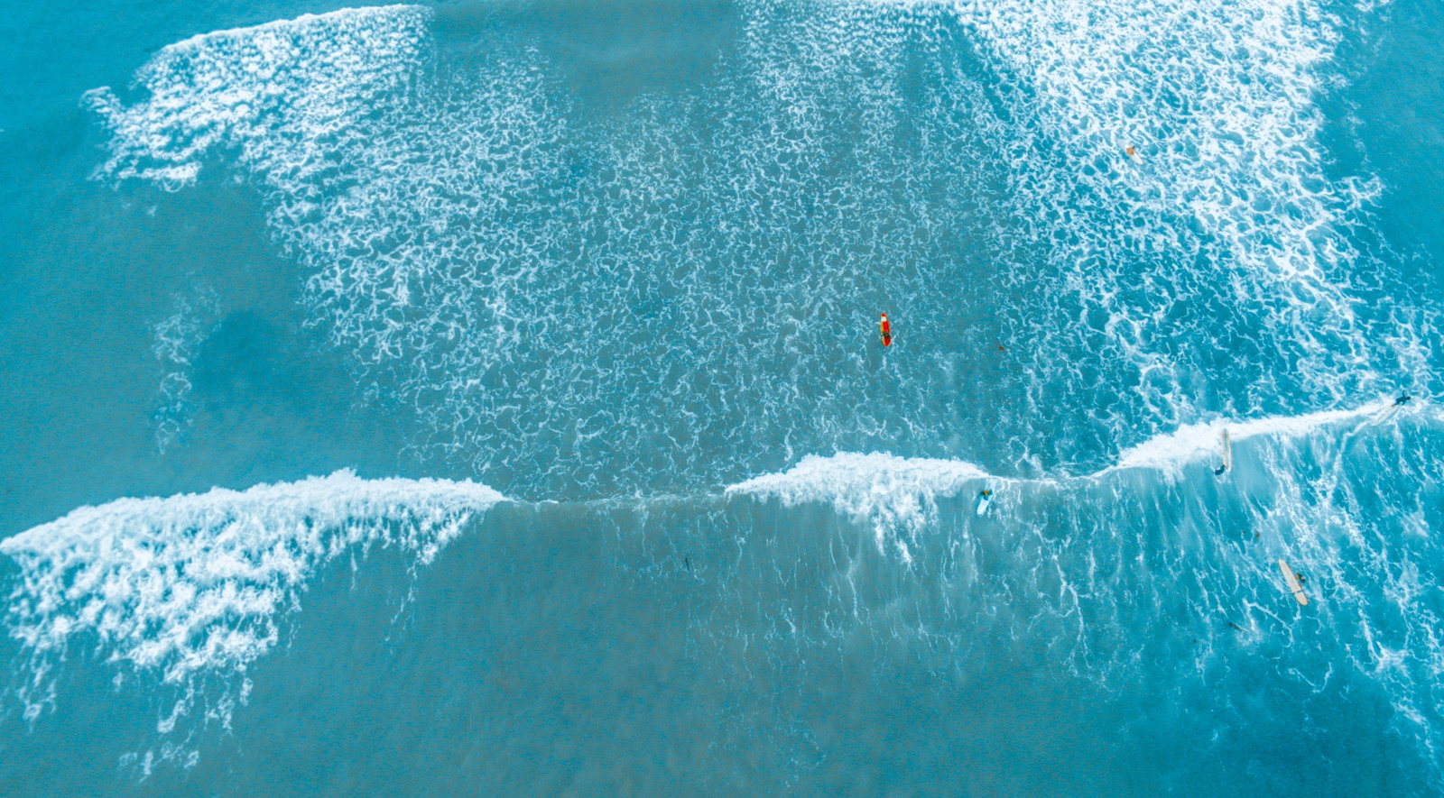 aerial photography of barrel wave top view body water 2k 4k