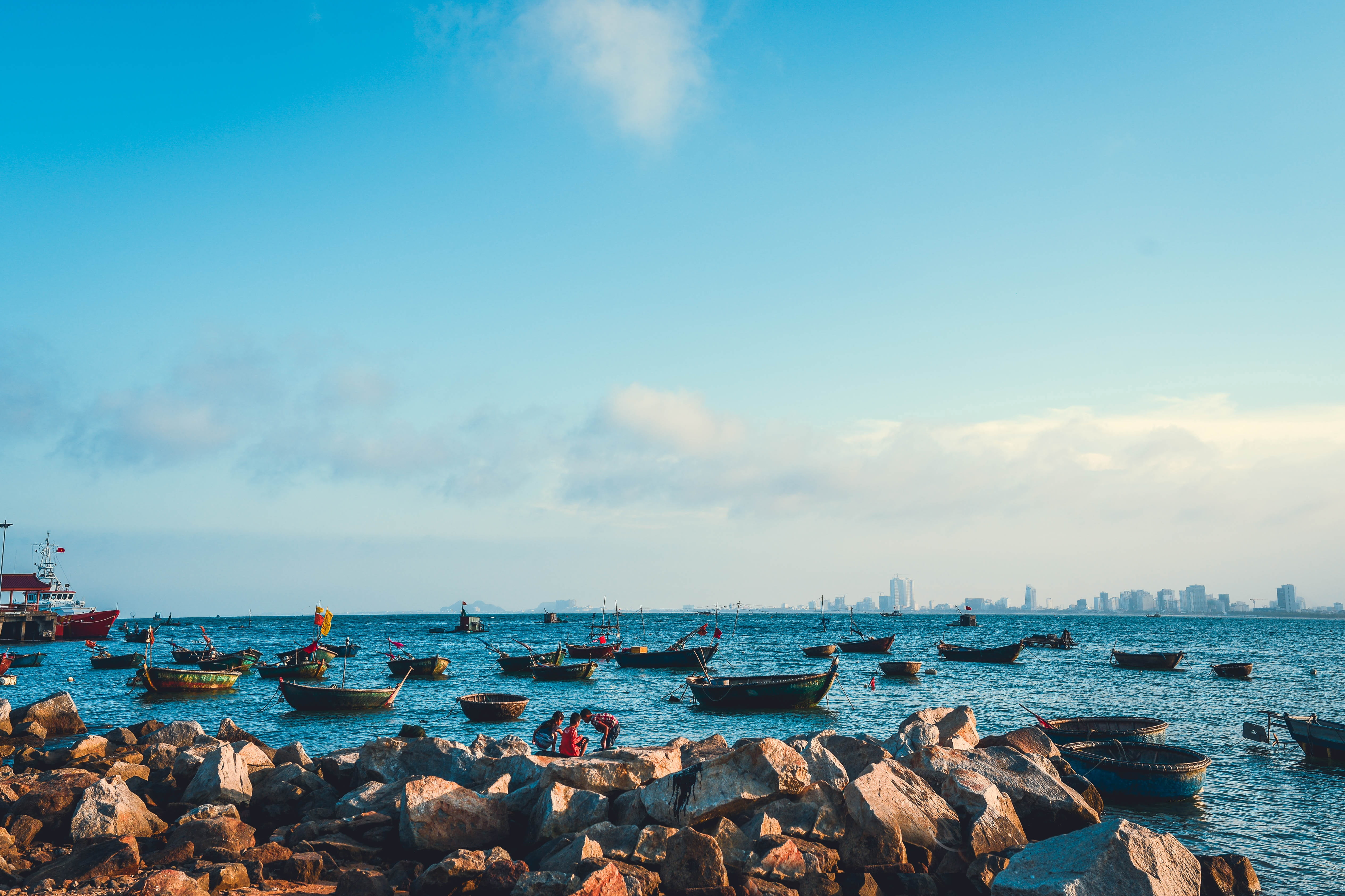 boats on water under blue and white sky beach da nang viet nam 2k 4k 5k