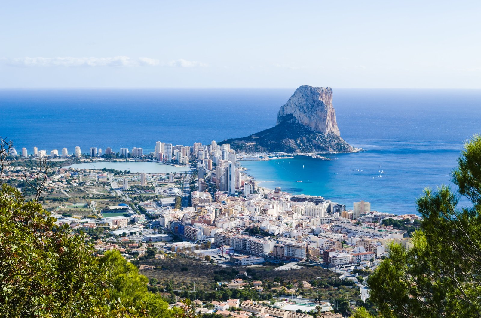 aerial photo of city beside sea spain calp larch tree conifer 2k 4k 5k