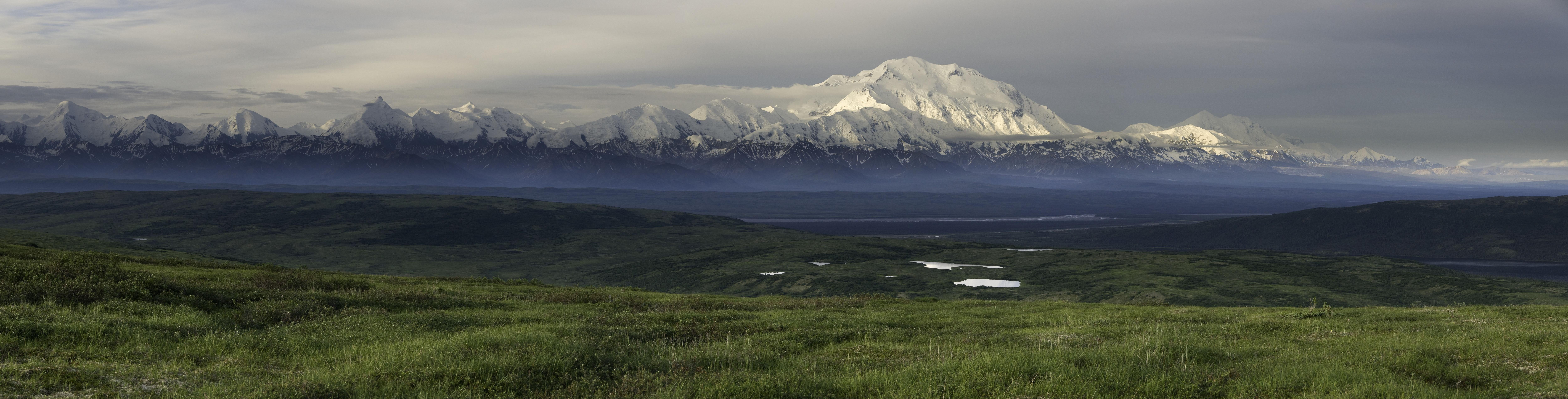 green field and mountains landscape ultra wide mountain pass 2k 4k 5k 8k 10k