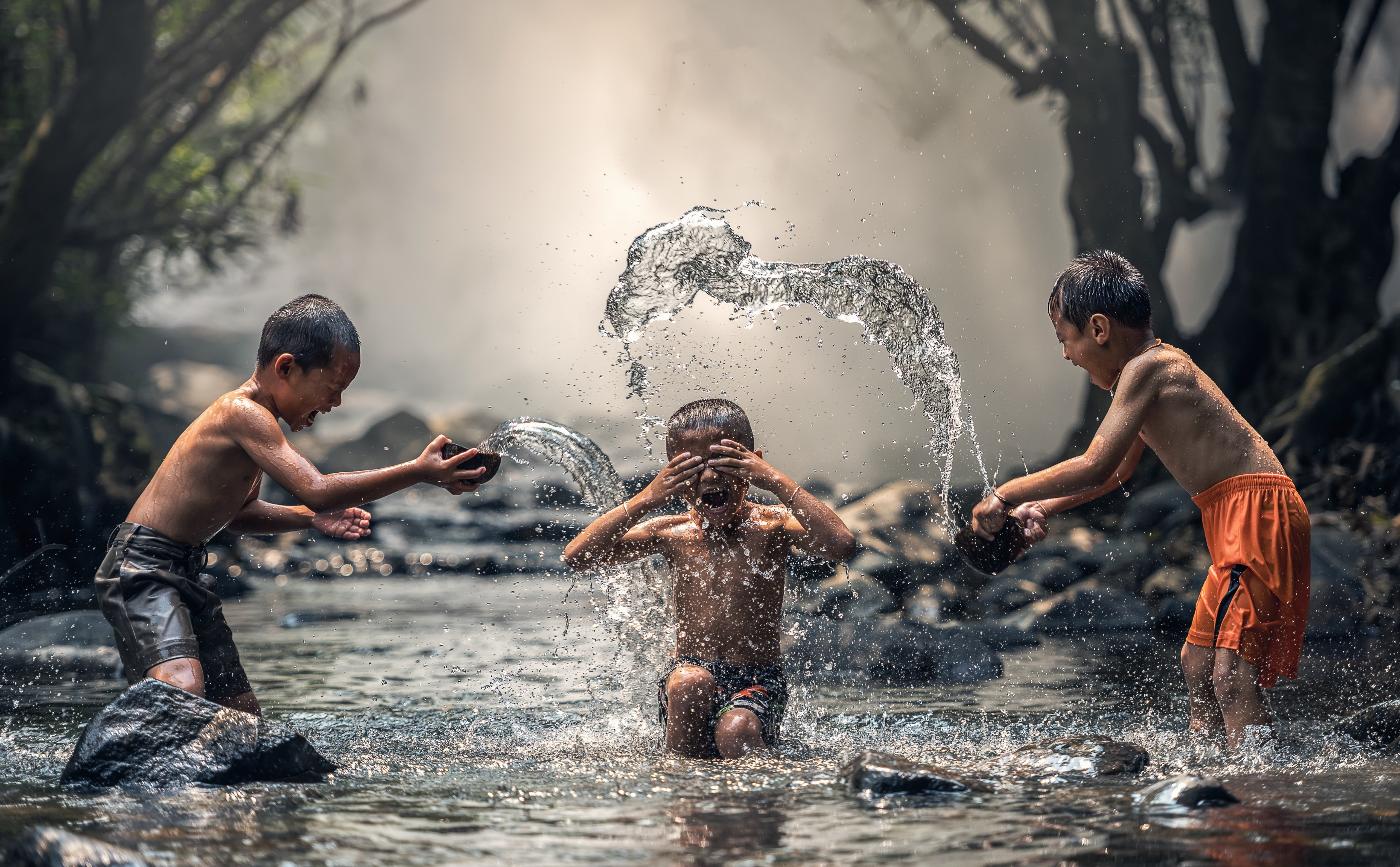 Kids Playing With Water boy s orange shorts Asia Thailand 2k 4k 5k