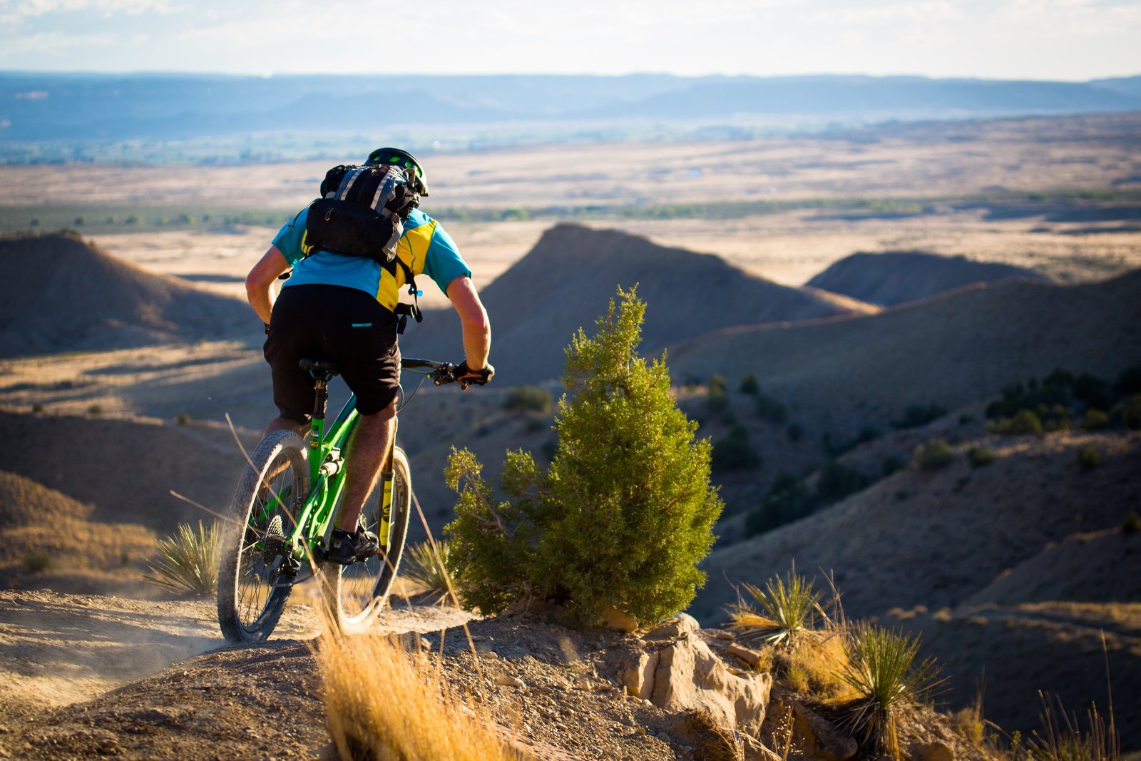 person riding green bike Dreamin mountain biking yeti summer 2k 4k 5k