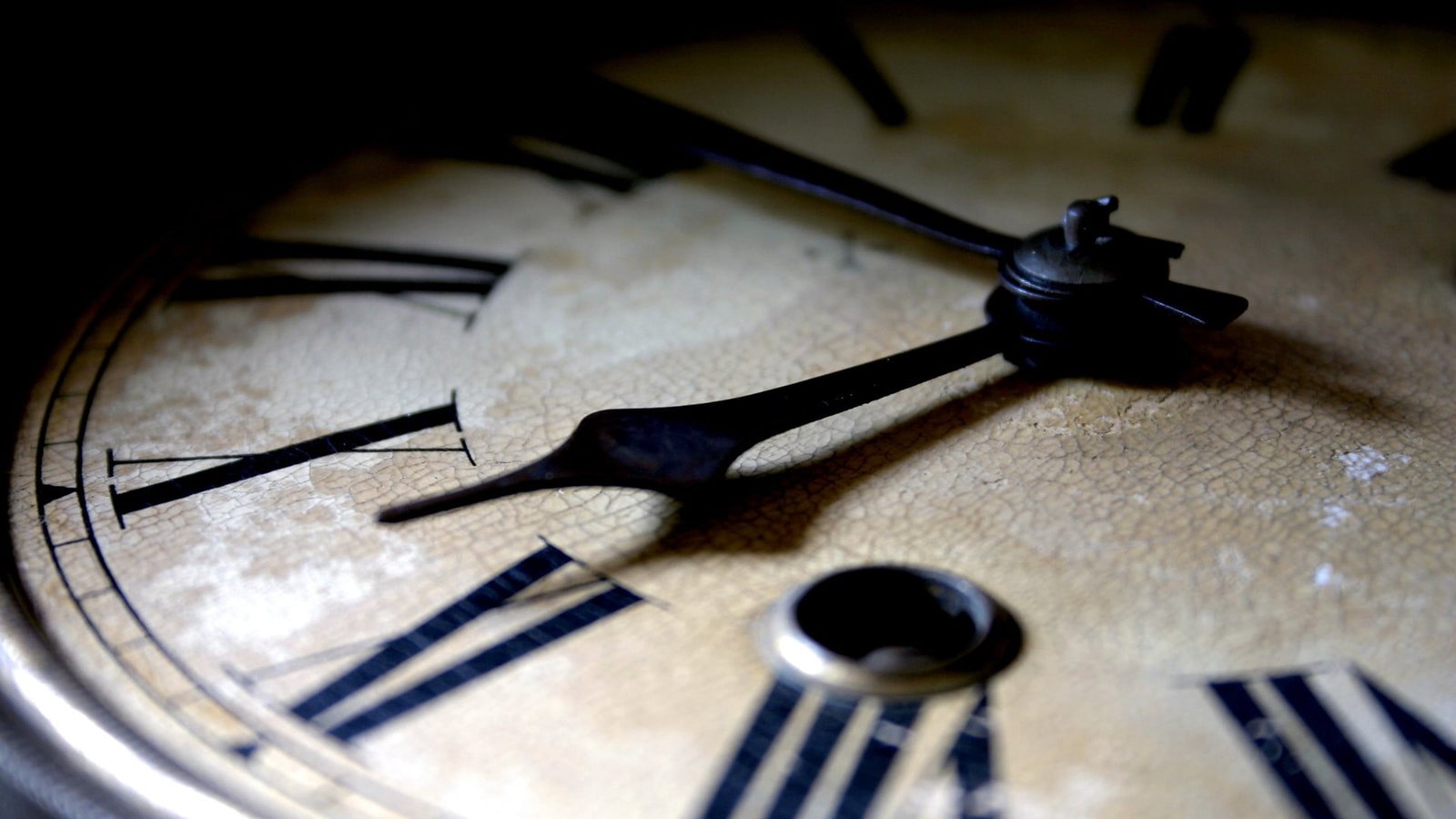 black and beige clock closeup photo of brown roman numeric analog 2k